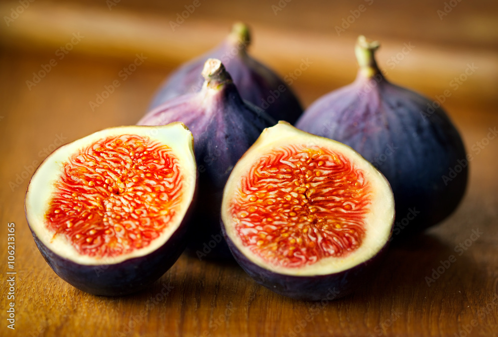 Wall mural portion of fresh figs on wooden background