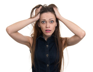 Fototapeta premium Shocked woman with her hands on the head