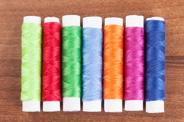 colorful yarn and neeldes for sewing