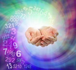Ask a Numerologist for guidance - female cupped hands emerging from an ethereal multicolored...