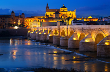 Fototapeta na wymiar Cordoba with Roman bridge and Mosque-cathedral in night