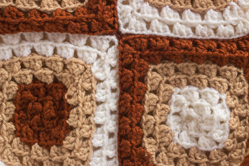 Fototapeta na wymiar Macro background pattern of woolen thread crocheted