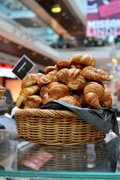 The delicious croissants in a basket for breakfast