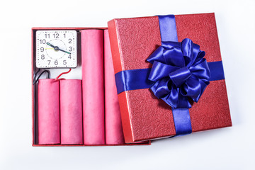 Bomb sticks of dynamite, in a gift box with a blue ribbon with c