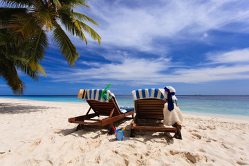 Two chairs on the tropical beach