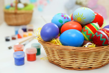 Fototapeta na wymiar Colorful Easter eggs on white table indoors