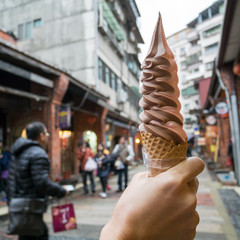 The delicious long Ice-cream cone (mixed strawberry and chocolate flavor) at food street market in...