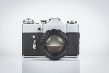 Retro camera isolated on white front view