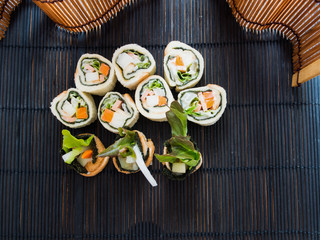 Sushi, a salad made of seaweed, vegetables and bread stuffed Bolognese.