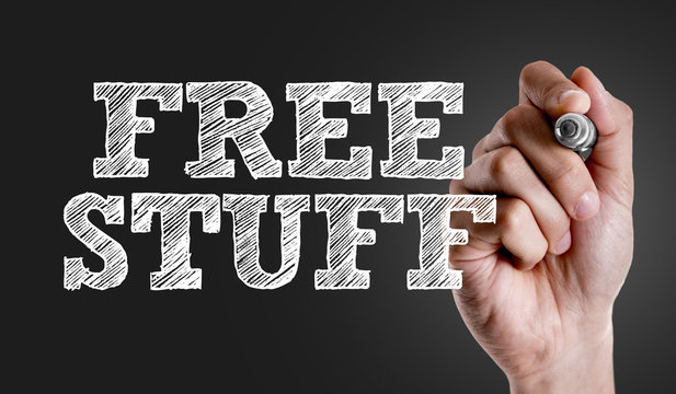 Hand writing the text: Free Stuff