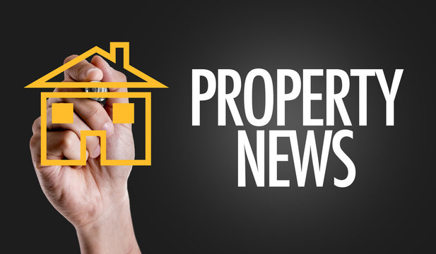 Hand writing the text: Property News