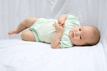 Happy baby lying on his stomach