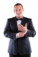 Businessman isolated over white background, smiling.