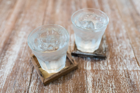 cold drinking water on wooden background