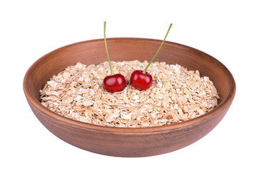 Oatmeal in a bowl with cherries isolated on white