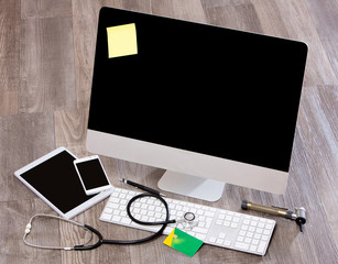 Wood doctor's desk in high definition with laptop, tablet and mo