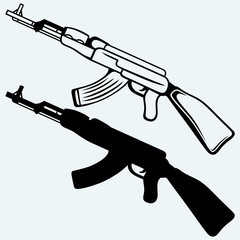 Assault rifle ak47. Isolated on blue background. Vector silhouettes