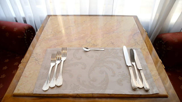 Setting with Plate, Knifes and Forks . This set has often served.