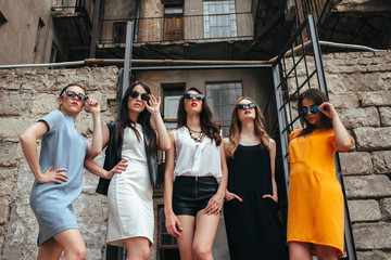 Five young beautiful girls in the city