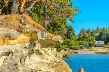 Rocky beach and ocean scenic for vacations and summer getaways. Famous Galaspina Rock Gallery at Gabriola Island, BC, Canada.