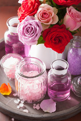 Obraz na płótnie Canvas spa aromatherapy with rose flowers essential oil salt