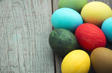 Easter eggs in nest on rustic wooden background, selective focus image, Card Happy Easter - space for text