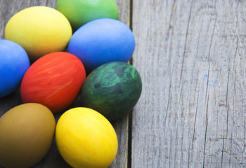 Easter eggs in nest on rustic wooden background, selective focus image, Card Happy Easter - space for text