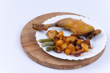 Fried chicken meat with potatoes in the plate
