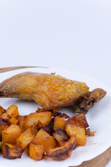 Fried chicken meat with potatoes in the plate