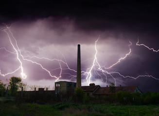 Thunder, lightnings and storm over abandoned factory in summer