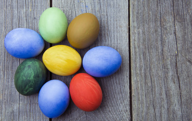 Easter eggs in nest on rustic wooden background, selective focus image, Card Happy Easter - space for text
