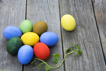 Obraz na płótnie Canvas Easter eggs in nest on rustic wooden background, selective focus image, Card Happy Easter - space for text