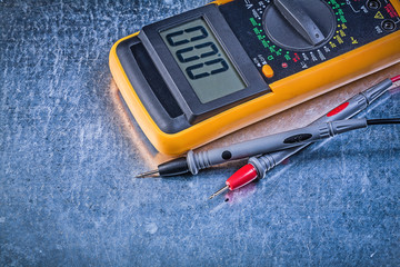 Digital electric tester current probe on metallic background