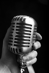 Fototapeta na wymiar Vintage microphone on black background