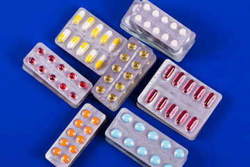 Selection of different pills in form of tablets and capsules
