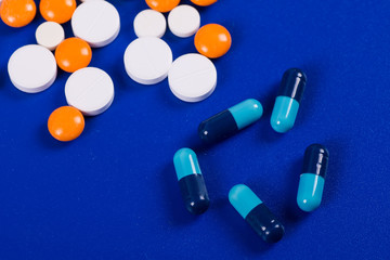 Selection of different pills in form of tablets and capsules