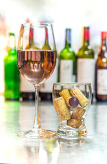 get drunk with rose wine, soft drink in glass with many wine cork