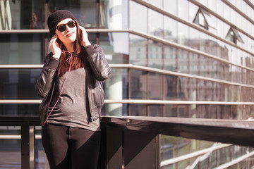 Fototapeta premium Young woman listening to music
