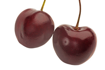 Two heart shaped cherry berries isolated on white background