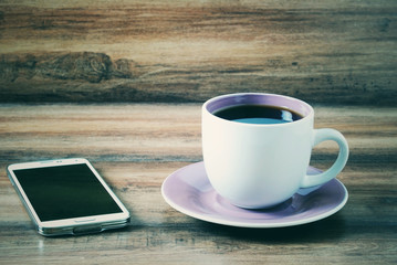 smartphone and a cup of coffee vintage style