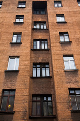 Facade of a multi-storey old house with windows