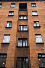 Facade of a multi-storey old house with windows