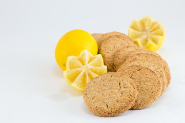 Integral biscuits with lemon on white background