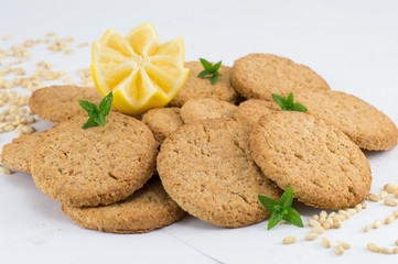 Integral biscuits with lemon on white background