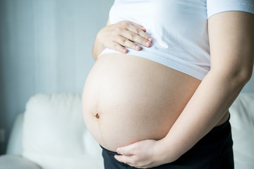 Pregnant woman with ultrasound scan picture