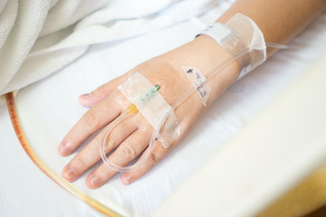 Close up of Asian woman patient in hospital with saline intraven