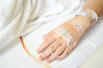 Close up of Asian woman patient in hospital with saline intraven