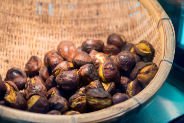 Grilled chestnuts in weave basket in japan