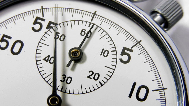 Stopwatch close up of clock face dial and hands