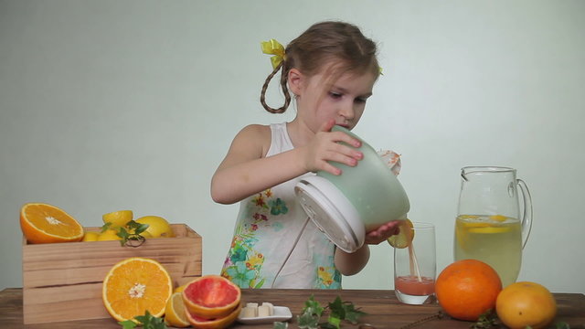 Girl pouring juice into a glass